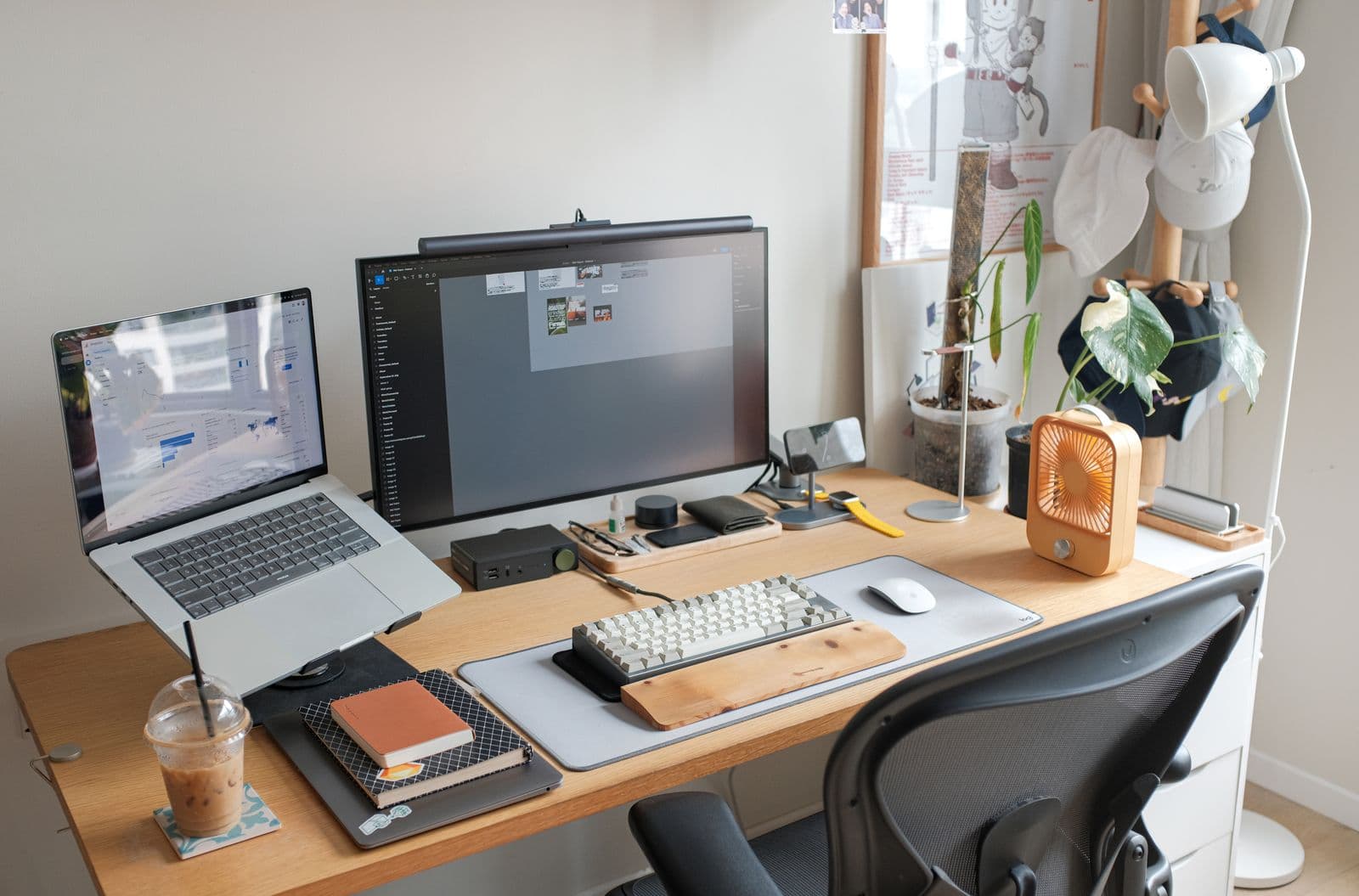 Compact home office desk setup with a laptop, IP phone, and network router
