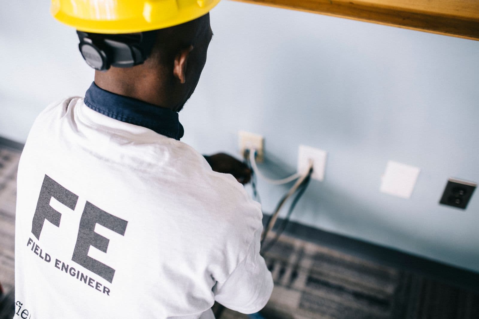 A field engineer completing a technical installation